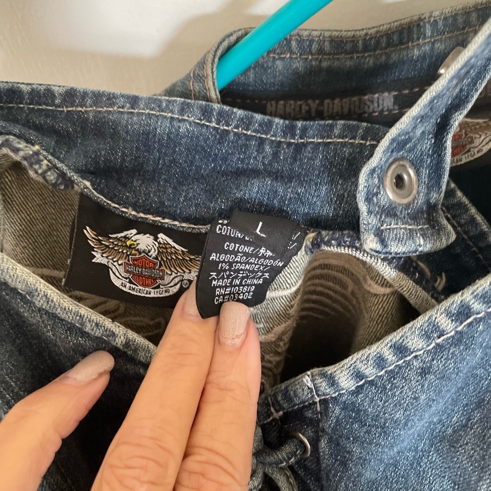 Woman’s size large Harley Davidson denim jacket and chemise.